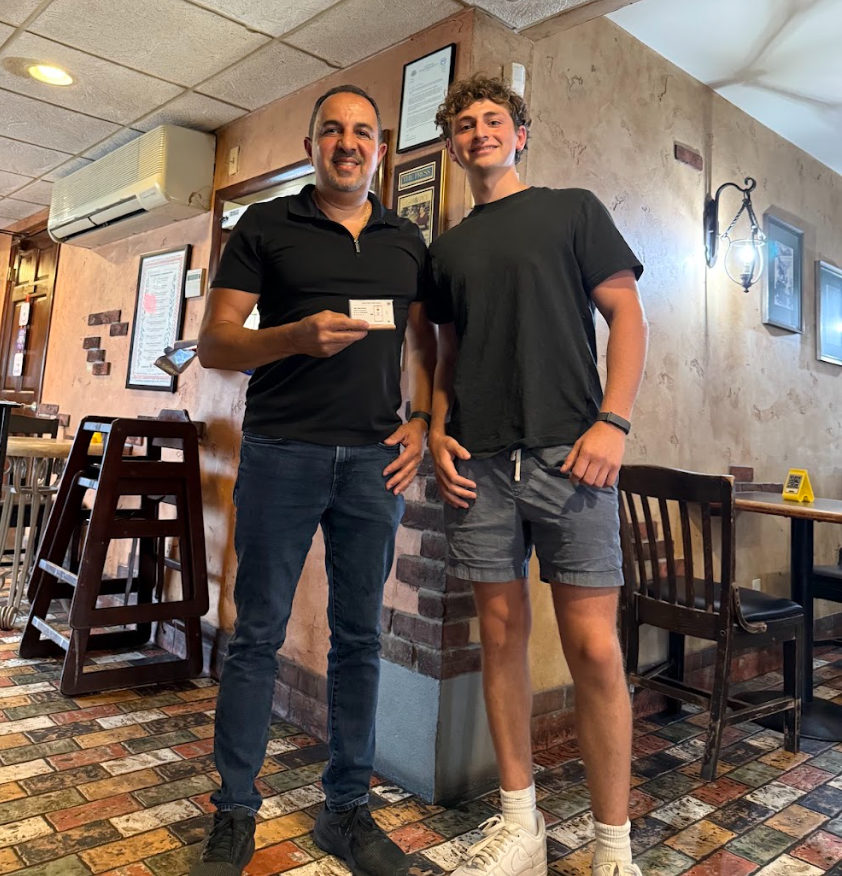 Tap-Tap founder with the owner of Cafe 360 holding their NFC review card